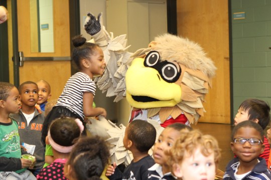 Freddie the Falcon meets with kids at the Arthur M. Blank Family Youth YMCA at an event promoting the Quality Rated program