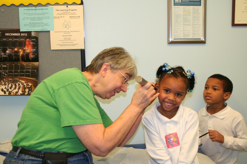 Dr. Jaquelin Gotlieb examines a new patient, Jada Smith, 5, at her Stone Mountain office