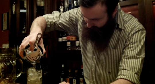 Jimmy Rowalt fixes a drink at the Highwire Lounge in Athens