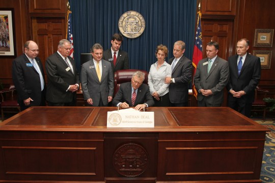 Gov. Nathan Deal signs "Chase's Law'' in 2012.