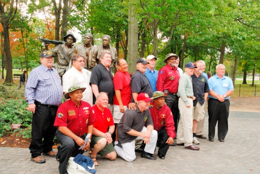 Vietnam War veterans gather in Washington, D.C., at a memorial.