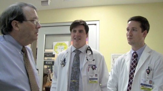 Dr. Stephen Lucas (left), with medical students, emphasizes the importance of having checklists to prevent errors.