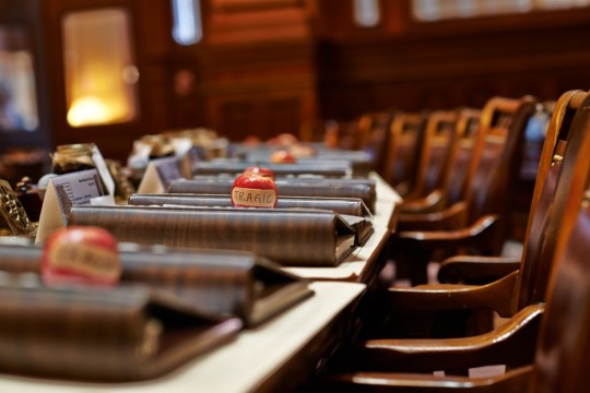 TRAGIC members placed apples on legislators' desks Tuesday.