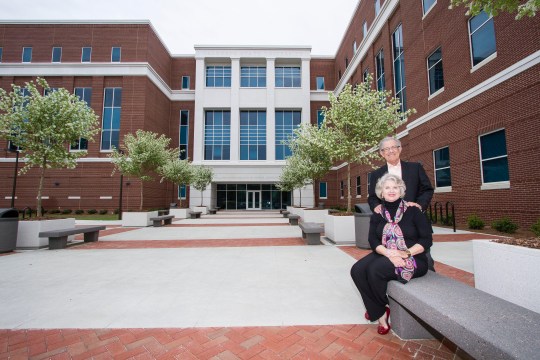 Martin and Laura Lynn Miller in front of the new Health Sciences and Business Administration building