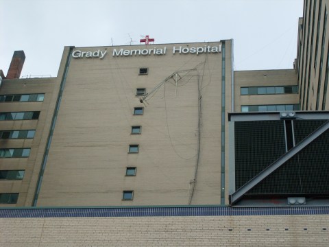A communications tower dangles from the Grady Memorial Hospital roof after a tornado hit Downtown Atlanta.