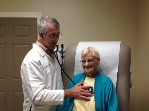 Dr. Samuel Church with a patient in his Hiawassee practice.
