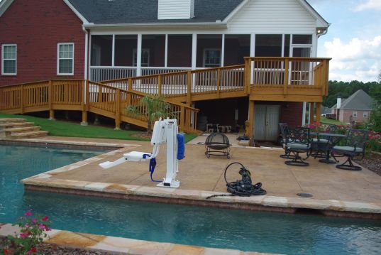The Hamricks modified their Loganville home after Craig's spine injury, including a porch with a dual ramp to the backyard and pool deck, which also has motorized lift chair.