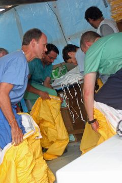 CDC workers and prepare to enter an Ebola treatment unit in West Africa.