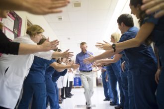 Dr. Kent Brantly is congratulated by Emory University Hospital nurses and staff as he is discharged after receiving treatment for Ebola. 