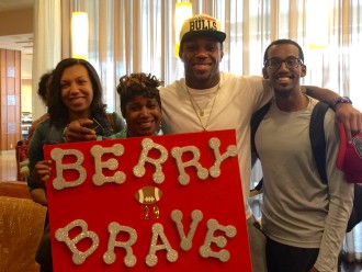 Eric Berry with (from left) Winship nurse practitioner Andrea Penn, Winship nurse Stephanie Jones, and Winship pharmacist, Yemag Limay.