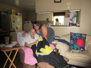 Lexi Crawford with her mother, Cristy, in their Waycross home. Lexi has rhabdomyosarcoma.