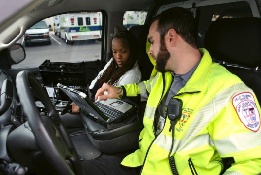 Matthew Thornton, a paramedic, and Dr. DeAnn Bing visit patients in their home for Grady.