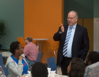 Dr. Feldstein speaking with students.