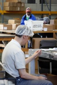 Two Easter Seals clients work in the organization's employment center.