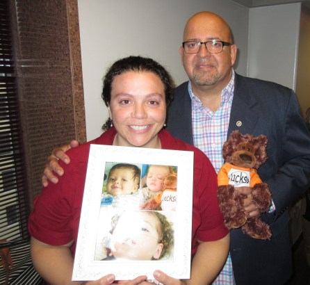 April and Daniel Garcia, with photos of Jackson, after legislative hearing.